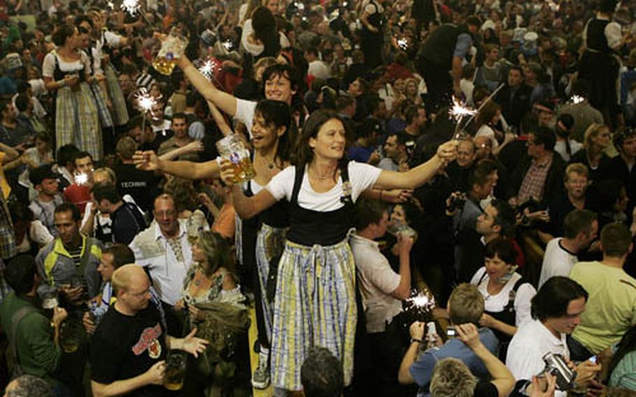 Waitresses celebrate on tables during the end of the last day of the 174th beer festival Oktoberfest in Munich, in 2007.