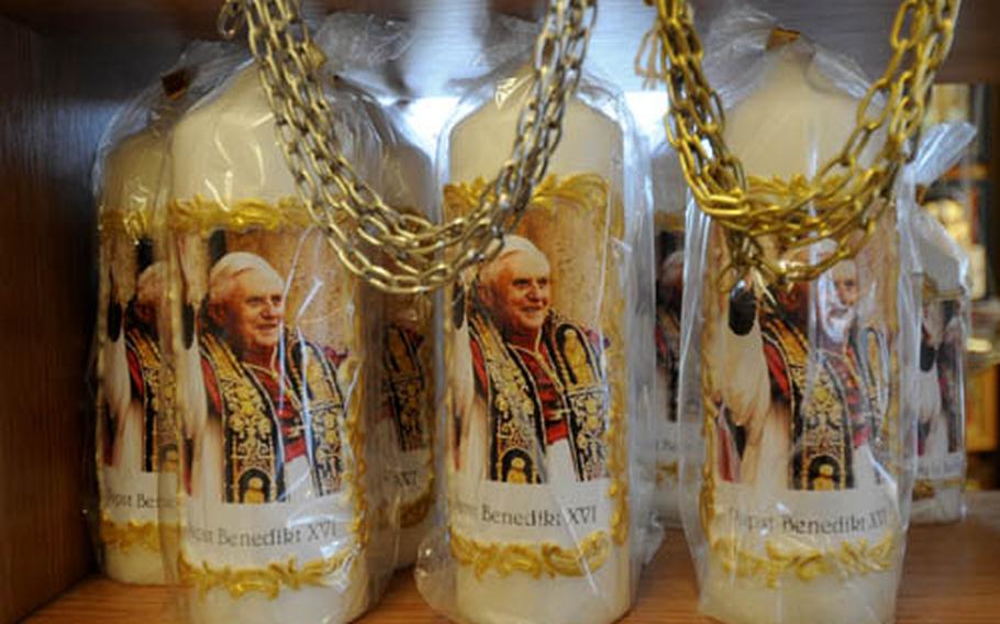 Candles with the face of Pope Benedict XVI are a bestseller at the cloister store.