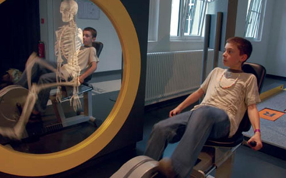 A skeleton pedals along with a German schoolboy at the Dynamikum museum in Pirmasens, Germany.