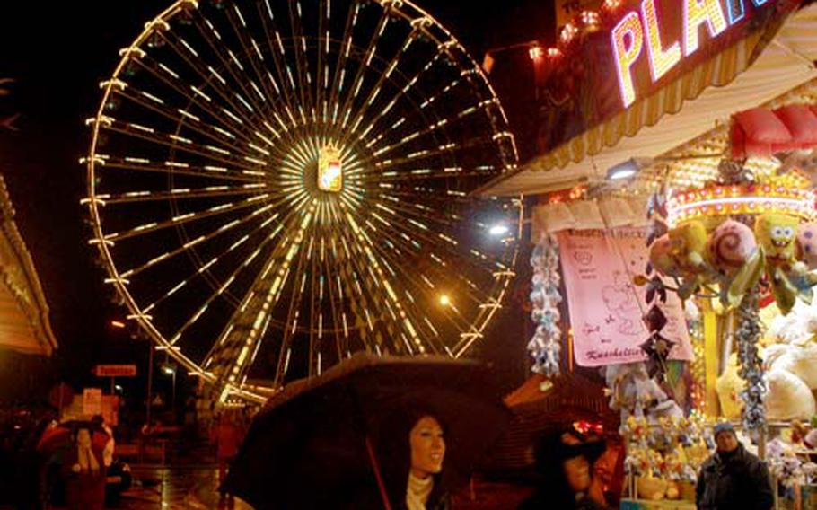 The 150-foot-high “Royal Bavarian Wheel” is one of the symbols of the Hochheimer Markt, a combination farmers market, county fair and carnival held near Wiesbaden, Germany.