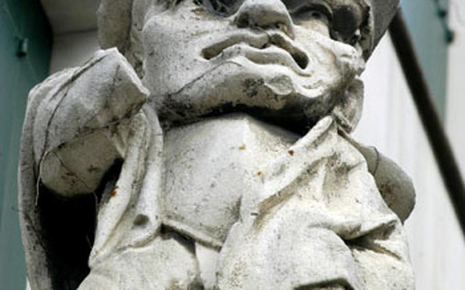 A statue of a stern-looking dwarf stands atop the outside wall of the Villa Noni-Mocenigo in Monselice, Italy. “Noni” is dwarf in Italian.