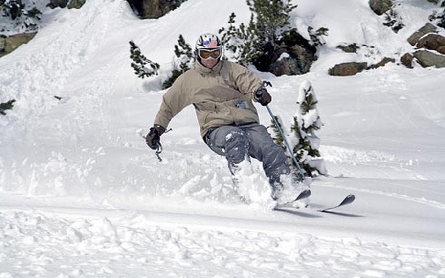 Robson sends snow flying at Hochoetz. On powder days, the trees are where some of the best steep and deep snow can be found, untouched by beginners.