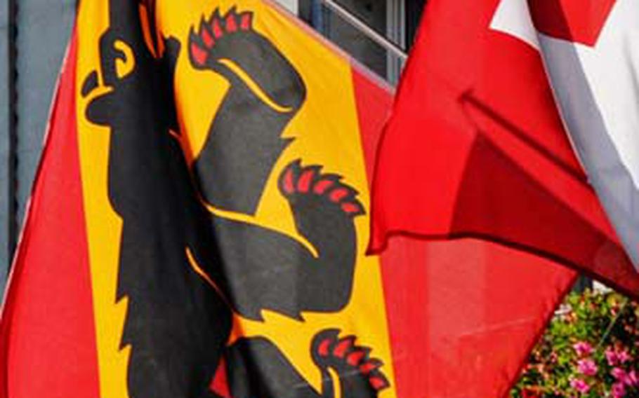 The official Bern flag at town hall naturally displays the bear next to the national flag of Switzerland.