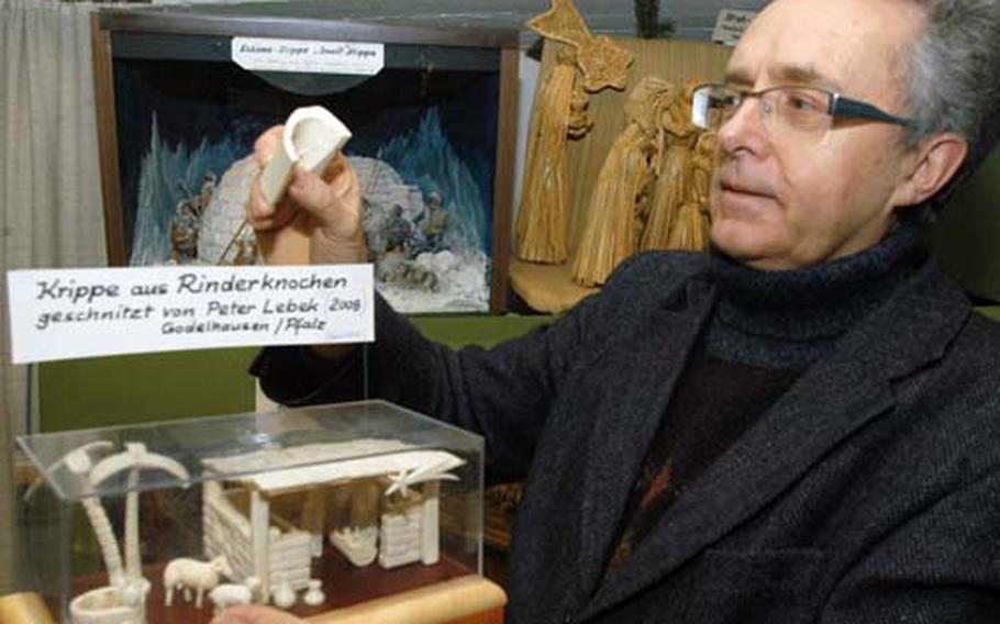 Karl Heindl shows a crèche created from the bones of cattle by artist Peter Lebek as a gift for Heindl.