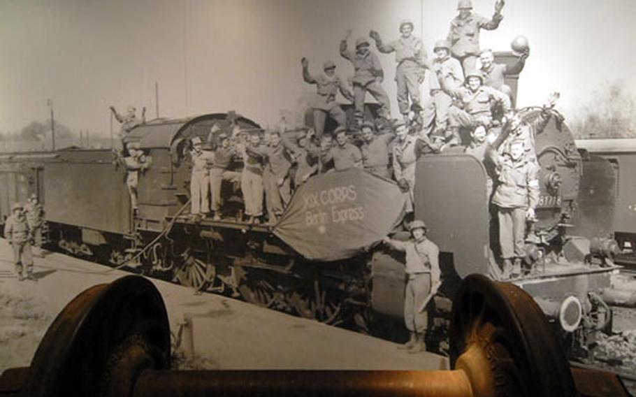 U.S. soldiers of the XIX Corps pose on an engine dubbed the Berlin Express at the end of World War II. The photo is part of the historic exhibit at the DB Museum.