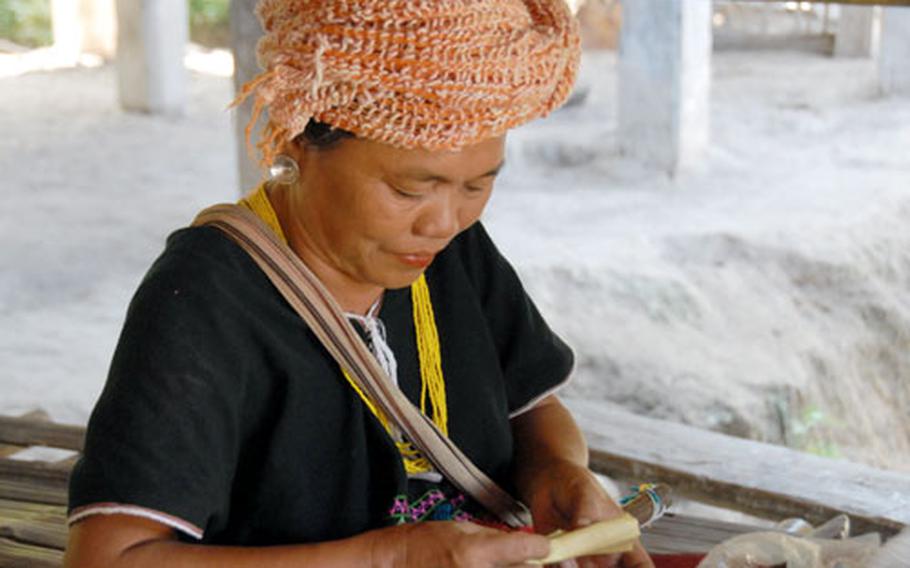 A Karen woman rolls cigars at a remote village about an hour&#39;s drive and another hour&#39;s hike outside of Chiang Mai.