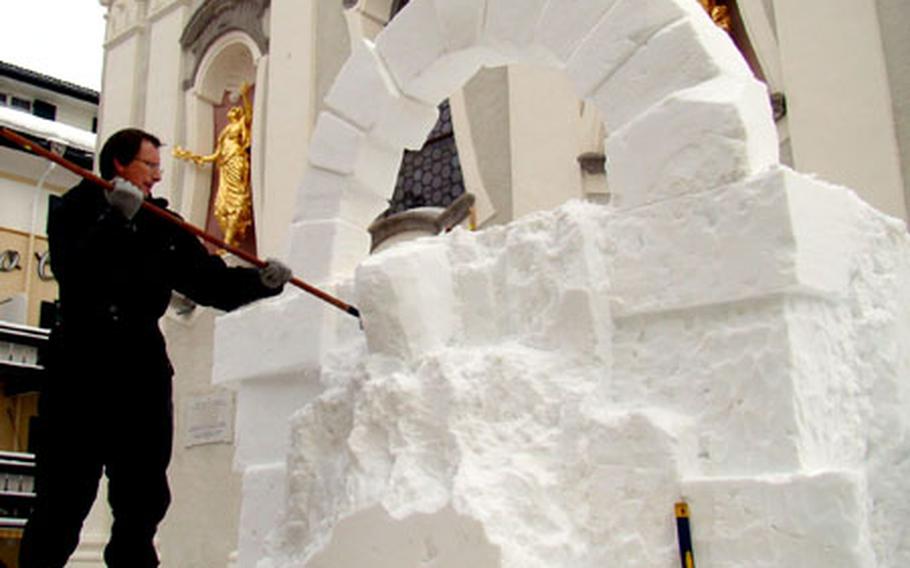 With the San Candido town church as a backdrop, a team member from the Untied Kingdom works on “Flight of Daedalus.”