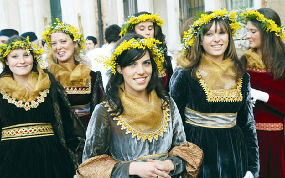 Photos by Michael Abrams/Stars and Stripes Girls dressed in medieval-style clothes wait for the Festa delle Marie procession to begin at San Pietro di Castello church in Venice. Although the event is a recent addition to the Venice carnival, the origins of the procession date to the 10th century.