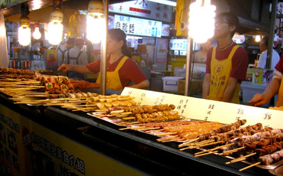 Yakitori is one of the dozens of foods in the maze of stalls at Shilin Night Market. This stand also sold footlong sausages.