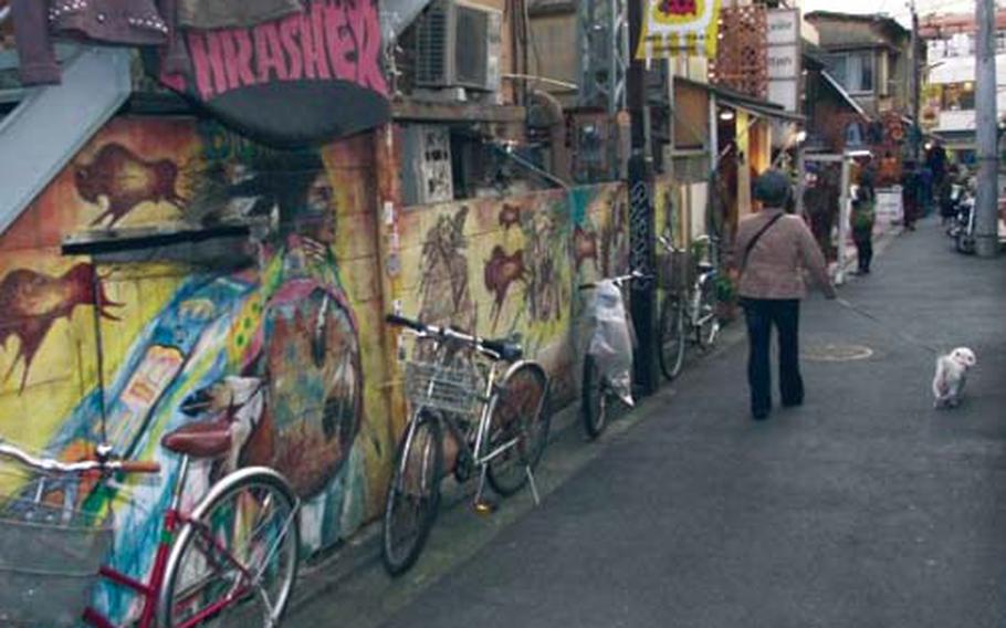 Shimokitazawa’s cramped alleys are lined with bicycles and filled with shops, restaurants and often neat artwork, as shown here.