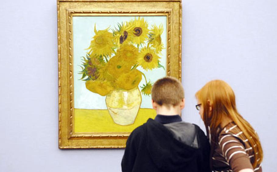 Students from the Garmisch Elementary/ Middle School read up on Vincent van Gogh’s “Sunflowers” during a visit to the Neue Pinakothek.