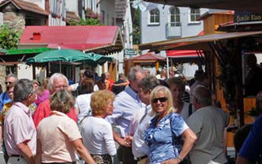 Locals and guests get together on a warm August afternoon at the Wicker wine festival, enjoying wine and conversation.