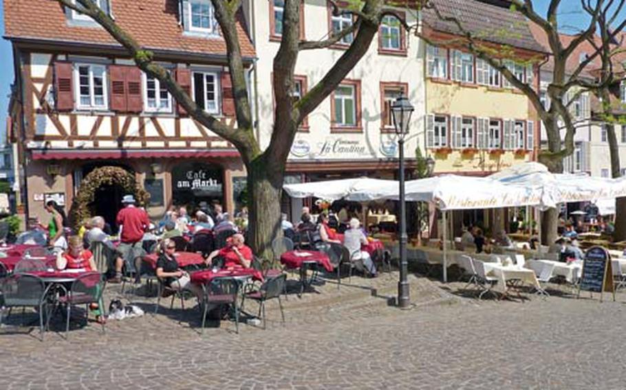 Weinheim&#39;s marketplace, lined with cafes and restaurants, is popular with locals and tourists.