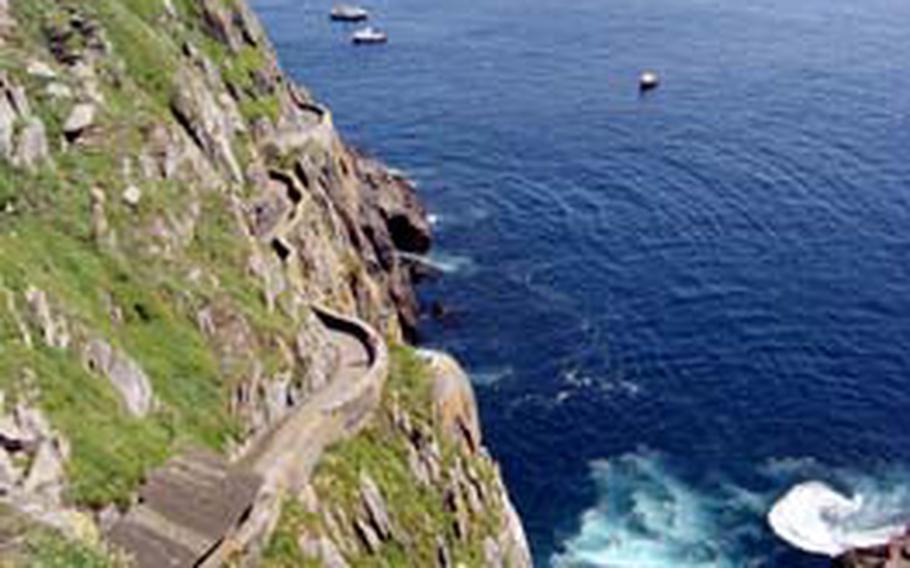 Climbers enjoy breathtaking views on the way to the top of Skellig Michael.