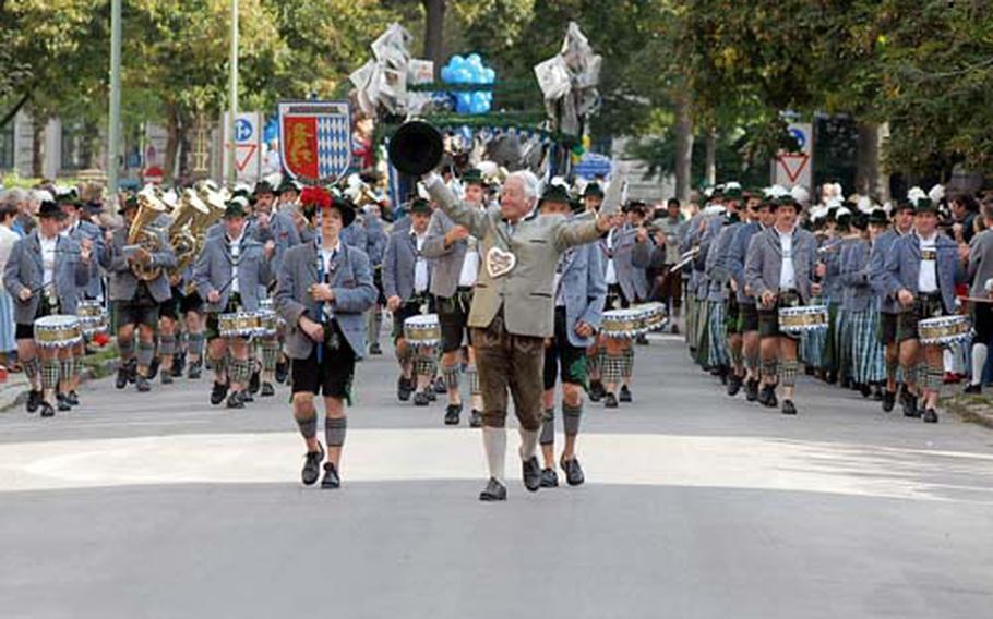 The Costume and Riflemen’s Parade makes its way down a Munich street on its way to the Theresienwiese, the Oktoberfest grounds, last year. The Sunday parade with about 7,000 participants is one of the highlights of opening weekend at Oktoberfest.