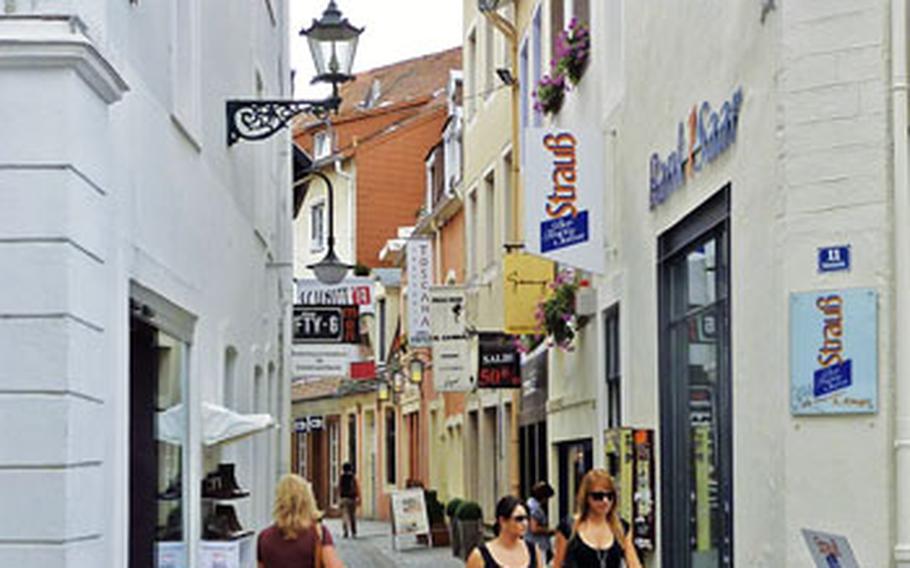 The Froschengasse, meaning frogs alley, is a narrow cobblestone lane lined with shops in Saarbrücken.
