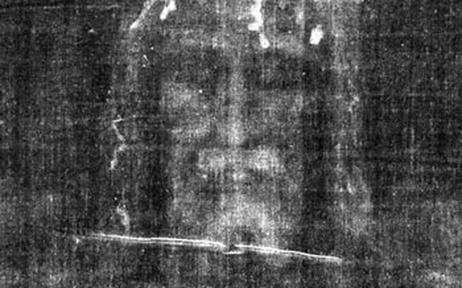 A close-up reveals a man whose appearance resembles images of Jesus. Wounds around the forehead are consistent with the biblical description of a crown of thorns placed on Jesus’ head.  