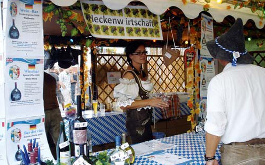 Petra Hess works the wine tent at the eighth annual Oktoberfest celebration.