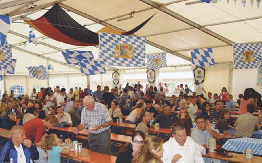 Thousands of revelers came through the main tent for beer, food and song at the Oktoberfest celebration Friday night on the NATO base in Naples.