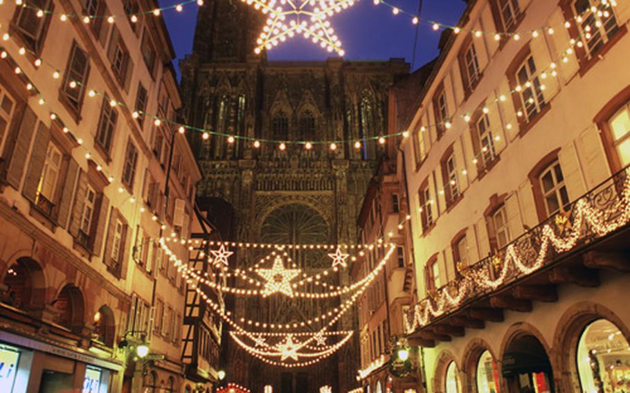 The magical view from Rue Mercière toward the west front of the Strasbourg cathedral at twilight is one of Europe’s must-see Christmas sights.