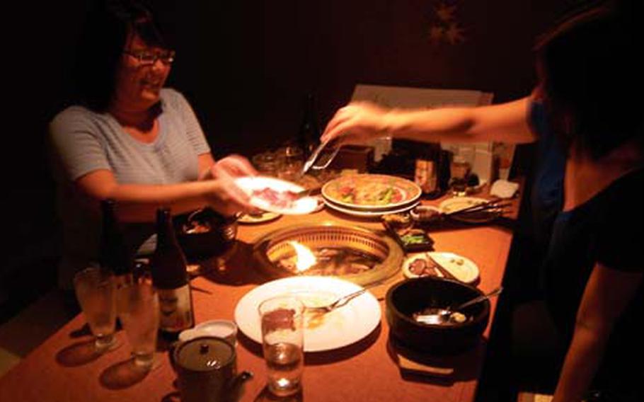 Meat is grilled at the table at Kuroton as part of an all-you-can-eat meal.