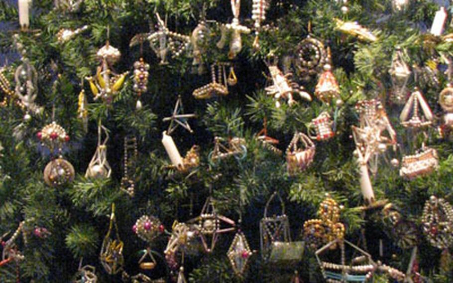 Delicate ornaments fashioned from glass beads and rods were created between 1920-1950 in Gablonz, a city now located in the Czech Republic.