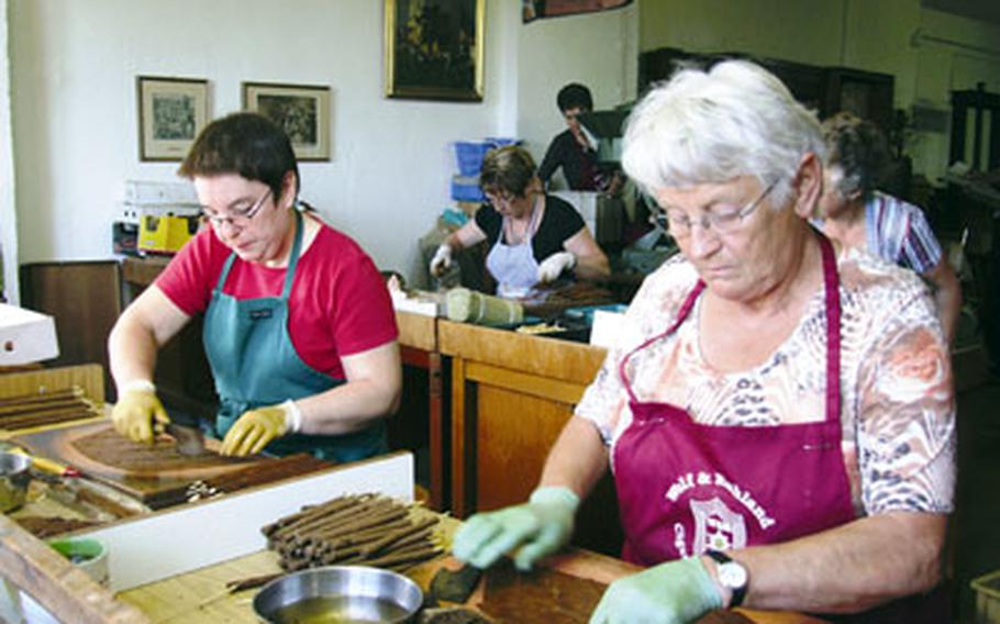 Seven women are employed making handmade cigars at Wolf und Ruhland in Perlesreut, Germany.