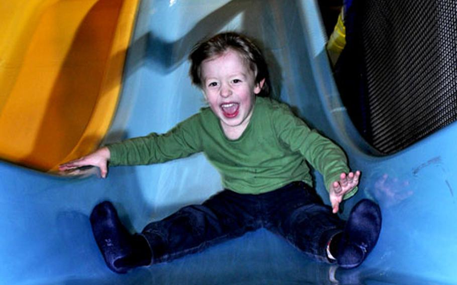 Four-year-old Linus enjoys a ride on one of the many slides at Tucherland.