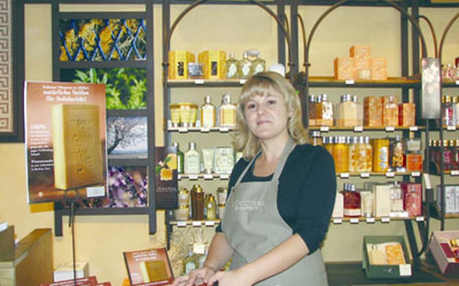 L’Occitane manager and French native Alexandra Bruni welcomes customers to her shop filled with the scent of lavender from the south of France, where the bath and beauty products are made.