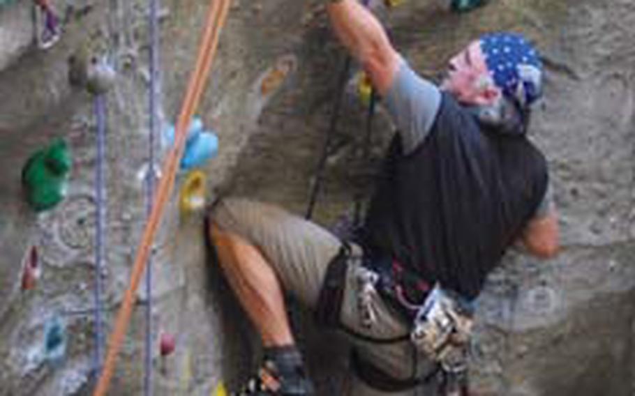 Christian Stolina works his way up one of the textured walls.