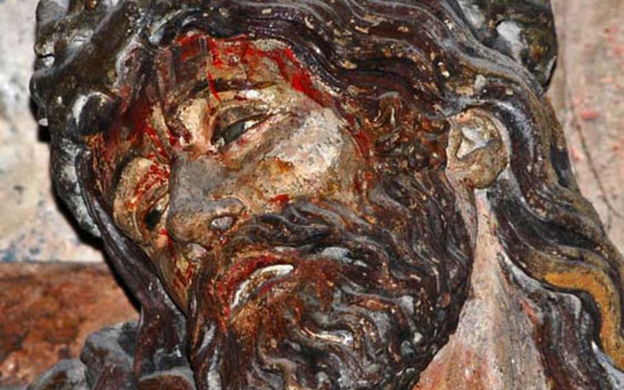 This suffering, emotional and realistic-looking Jesus is the center of the famed crucifixion group on the choir screen of Sts. Peter and Paul. Like the statues of the donors, it is the work of the so-called Master of Naumburg.