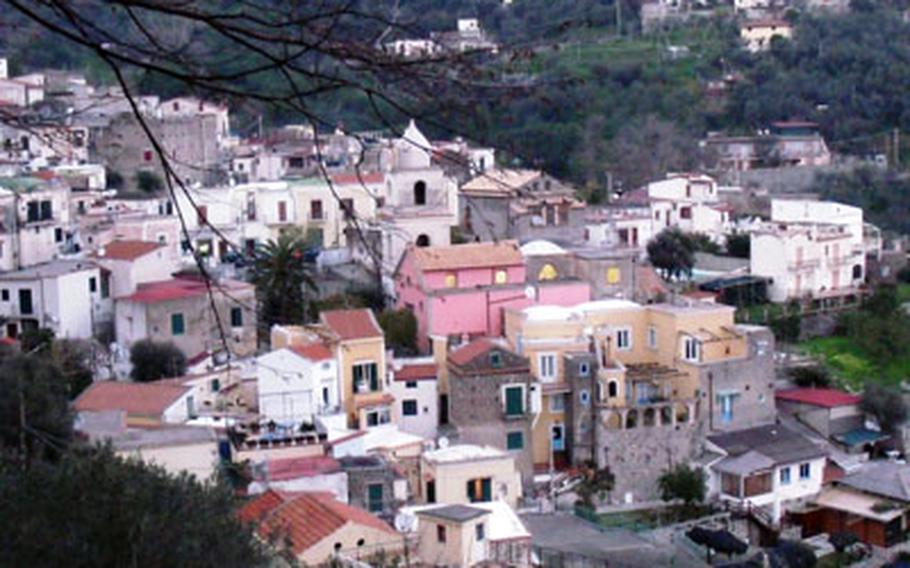 A glimpse of the town of Nerano with its pastel-colored buildings is seen from the hiking trail above it. The trail went through the town and then up a hill toward Punto Penna.
