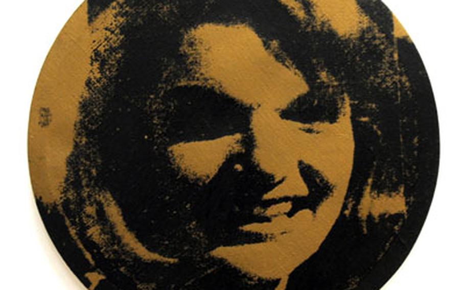 “Round Jackie,” a 1964 silkscreen print on canvas by Andy Warhol, is on display at museum.