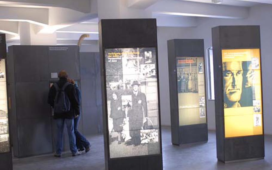 The depot building was once used to store the belongings of the prisoners at the Buchenwald concentration camp. Now it is an exhibit hall with artifacts from the camp and information about the Holocaust. It includes information about the number of people killed in Nazi death camps.