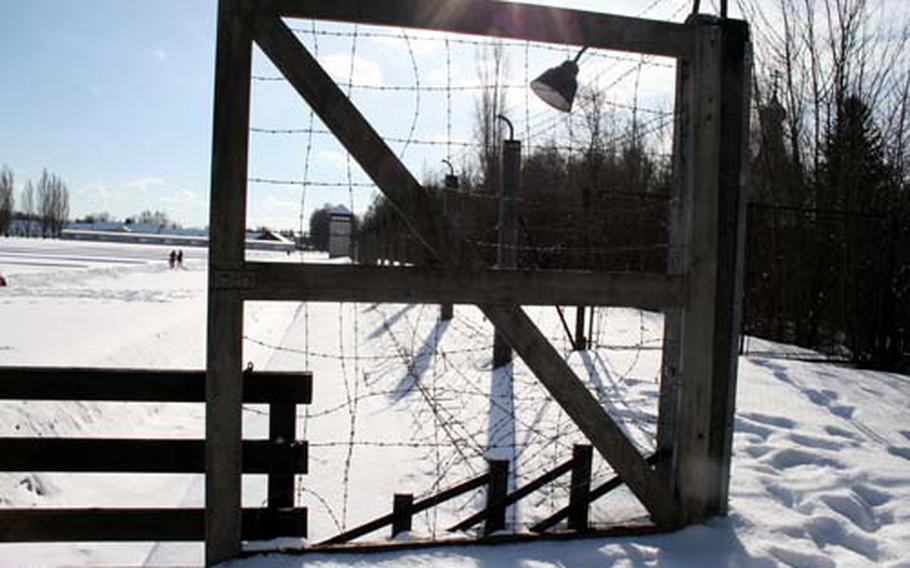 The fence line at Dachau. There were trenches filled with water and low barbed wire obstacles before the electrified perimeter fence. Some prisoners chose certain death in an escape attempt, rather than continue living in such conditions.