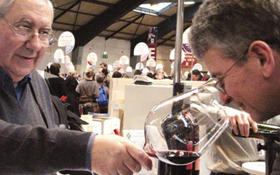 A patron inhales the bouquet of a Chateau Bouchat-Alaux wine, an important step in the wine-tasting process.