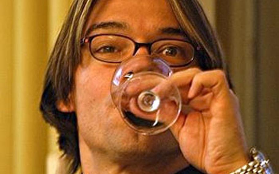 Christian Mappala, 43, German wine expert and leader of the wine sensory seminars takes a “nose full” of wine.