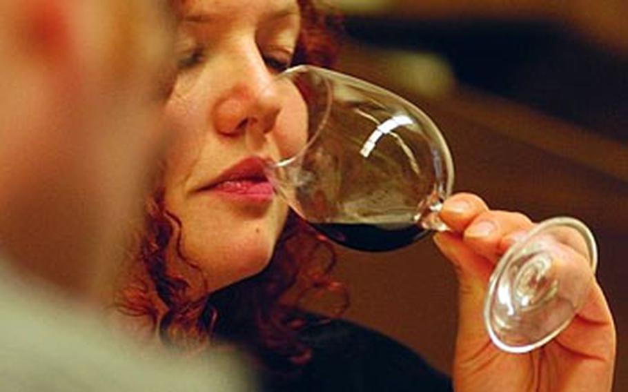 After examining the color, the second step in judging wine is to smell the aroma.