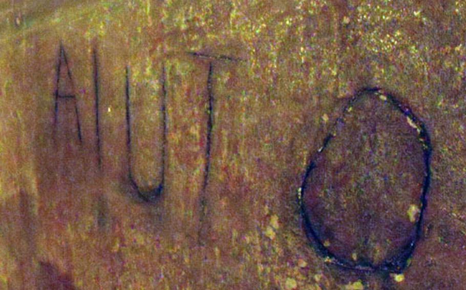 "Aiuto," Italian for "help," was scribbled on the wall in the catacombs underneath Naples during the World War II bombing.