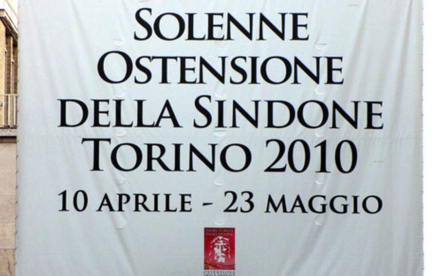 A banner that reads "Solemn Exhibition of the Shroud, Turin 2010, 10 April-23 May" hangs over the street at the end of Piazza San Carlo, one of the main squares in Turin, Italy. The city has rolled out the red carpet for the expected two million visitors for this year&#39;s exhibition.