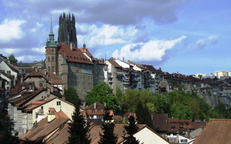 The tower of the 13th-century St. Nicholas Cathedral dominates the Fribourg skyline. The town is built on two levels, and includes a medieval old town.