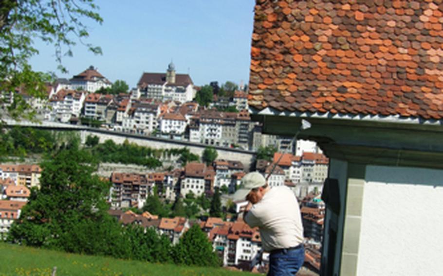 A player prepares to tee off and begin another hole of urban golf in the Swiss town of Fribourg. A round of golf is a good way to get to know the charming medieval town, while also getting plenty of laughs and exercise.