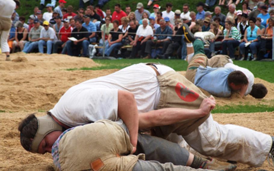 "Schwingen" wrestlers hang onto their opponent's shorts as they try to pin their foe's shoulder to the ground in a large sawdust-covered pit. Wrestlers get points for throws and for pinning their opponents. 