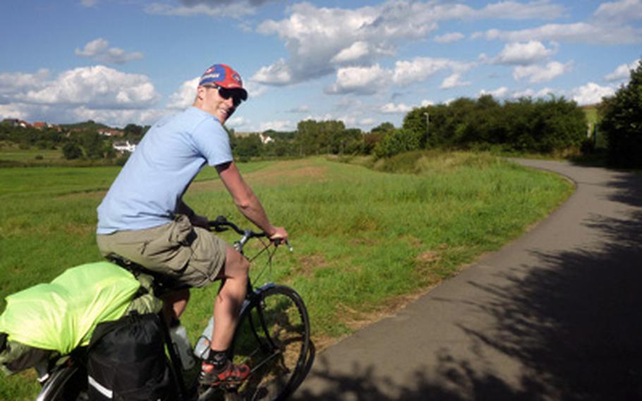 Nick Schulte cruises through a typical countryside scene near Steinwenden, Germany, not far from Ramstein Air Base at the end of the two-day bike tour.
