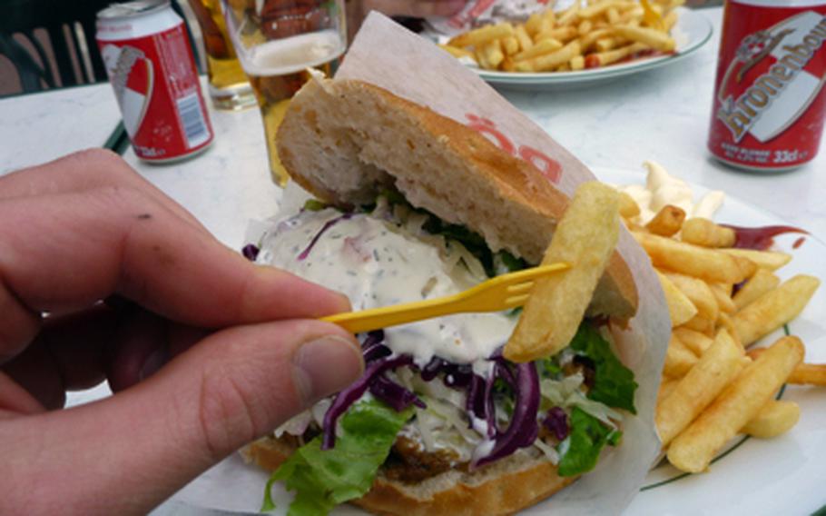 Fatty foods can make for some good energy on a bike tour.  French fries and a döner kebab are the tasty lunch during the cyclists' stop in Sarreguemines, France.