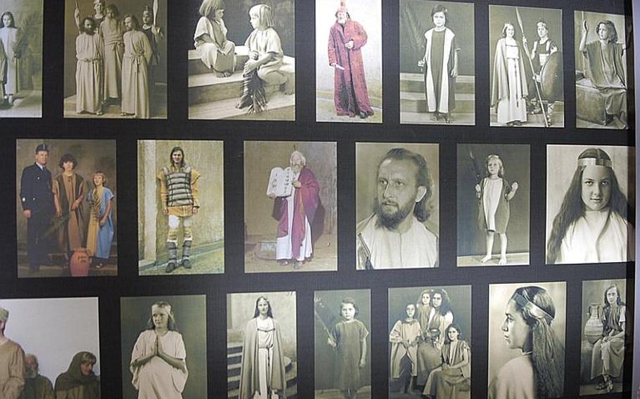 A photo collage of actors from past Oberammergau passion plays is displayed inside the town theater.