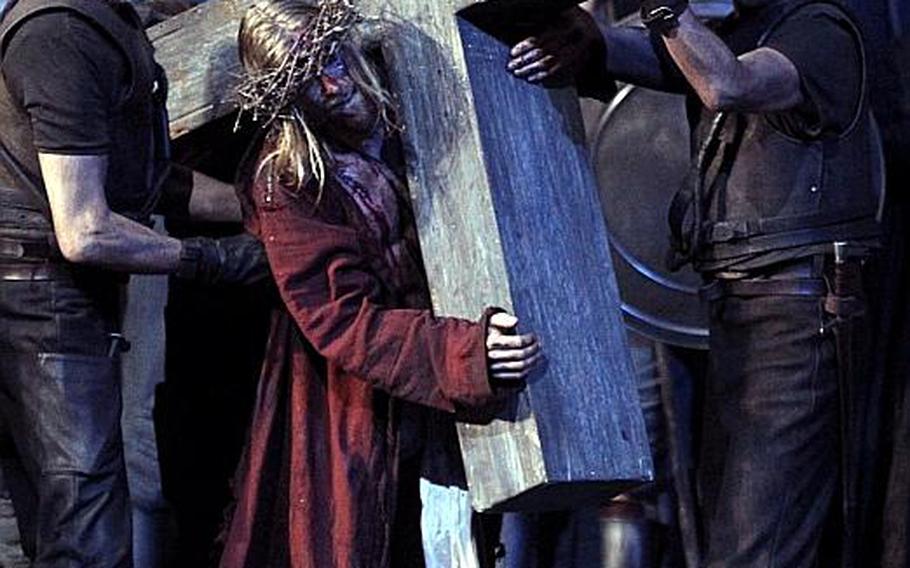 Andreas Richter portrays Jesus carrying his cross on the way to his crucifixion during a dress rehearsal of the passion play. 