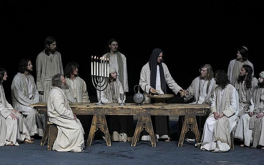 Frederik Mayet portrays Jesus, center, during the Last Supper during a dress rehearsal of the passion play.