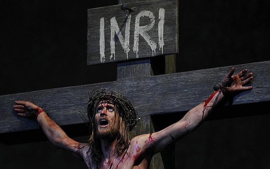 Frederik Mayet portrays Jesus during his crucifixion during a dress rehearsal of the passion plays 2010 in the theatre of Oberammergau, southern Germany. More than 2000 citizens of this Bavarian village participate in the century-old play of the suffering of Christ, staged every ten years and dating back to 1634.