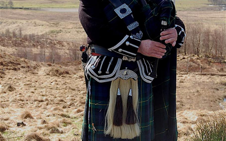 "Jack the Piper" entertains travelers at a scenic overlook. The piper is a former British soldier who continued to play the pipes after leaving the military. Be sure to pay the piper, or prepare to hear from him.